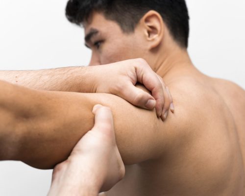 man-getting-shoulder-pain-massage-from-physiotherapist