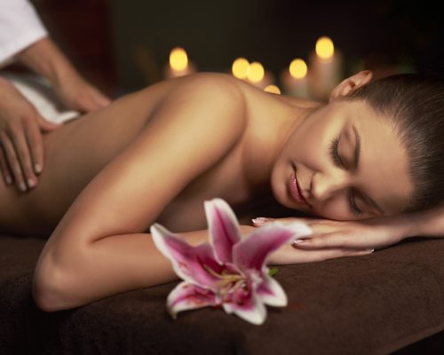 Woman paying visit at massage therapist